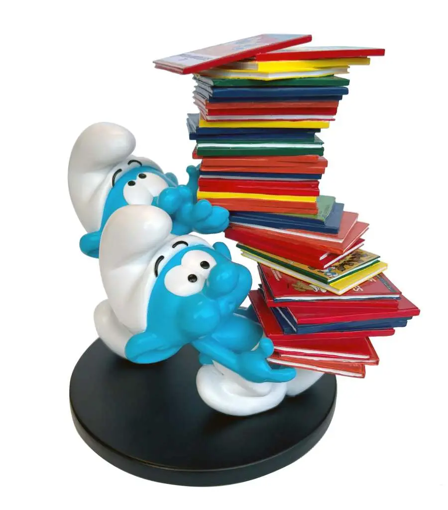 smurfs stack of comics collector figure